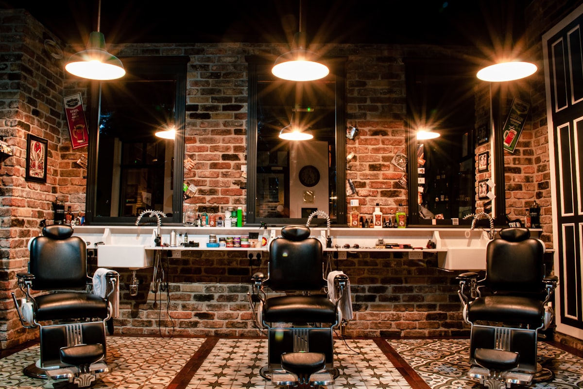 Barber chairs and mirrors in a salon where appointments are taken by an AI phone line